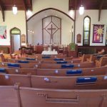 Photo of church pews before the altar